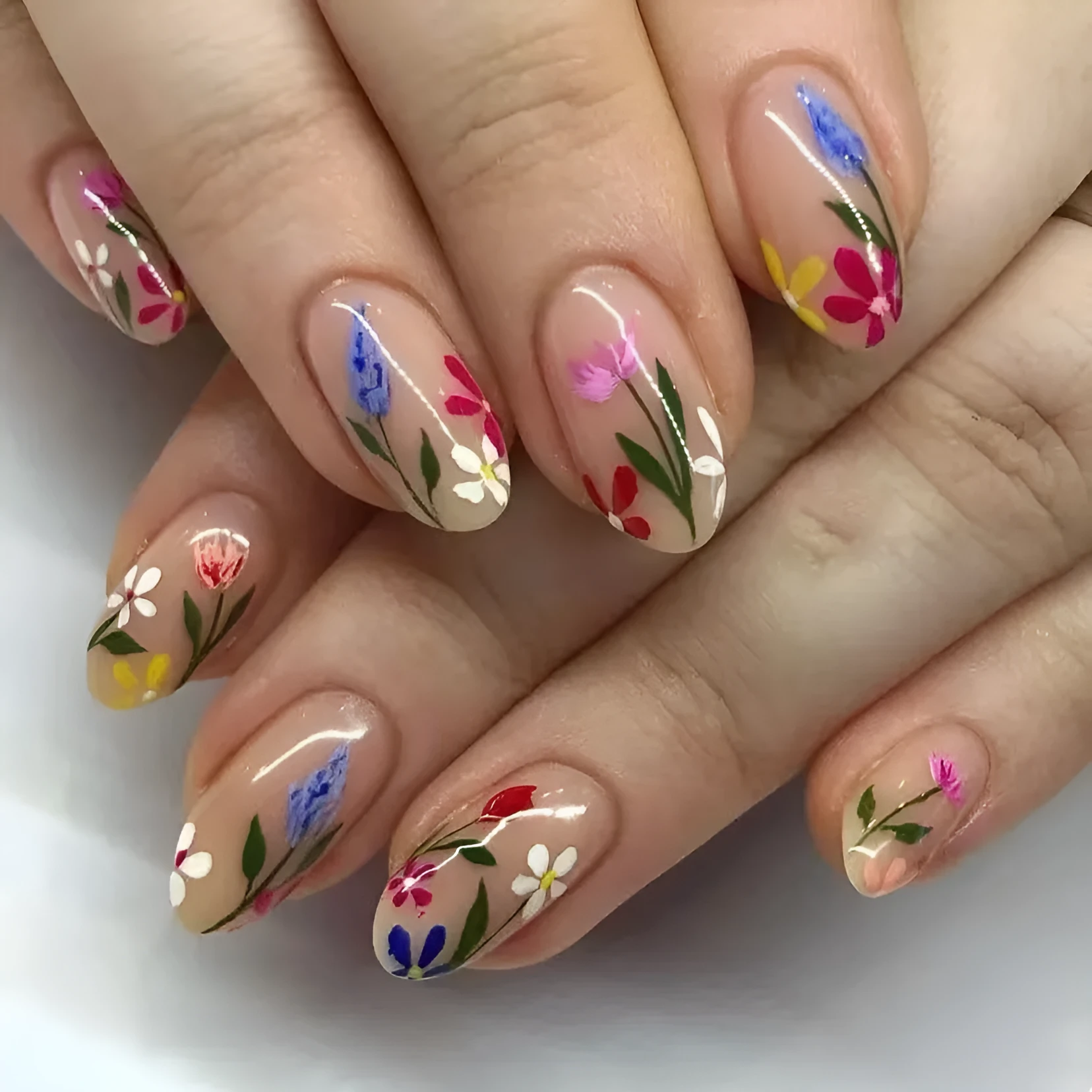 Removable flower pattern nail art set for almond-shaped nails in a rose and tulip design.