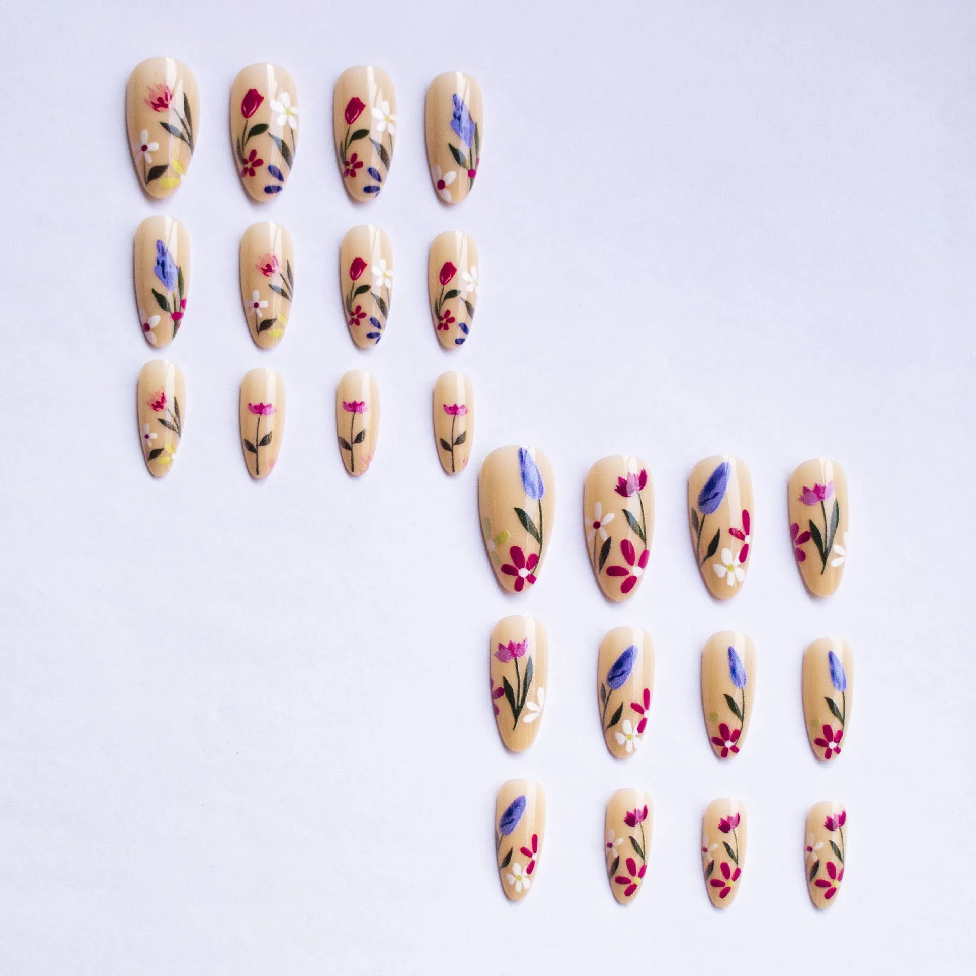 Removable flower pattern nail art set for almond-shaped nails in a rose and tulip design.