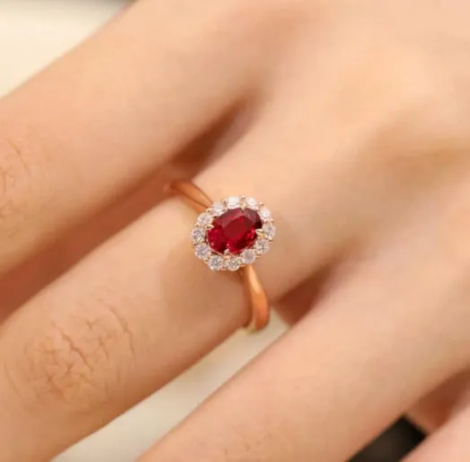 Gold pigeon blood ruby sterling silver ring with floral design and artificial gemstone centre
