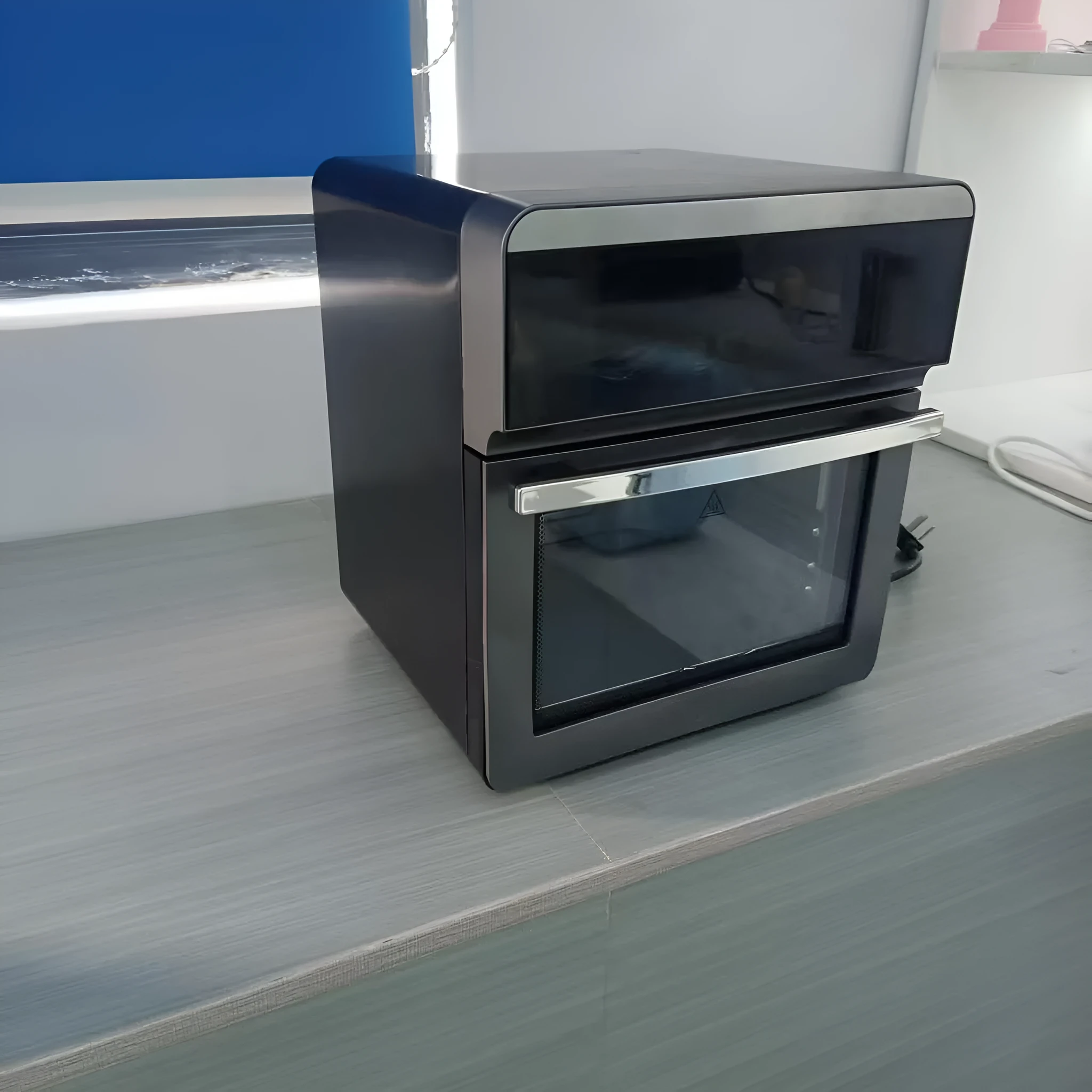 Household appliance in black finish with UK electrical plug for home use