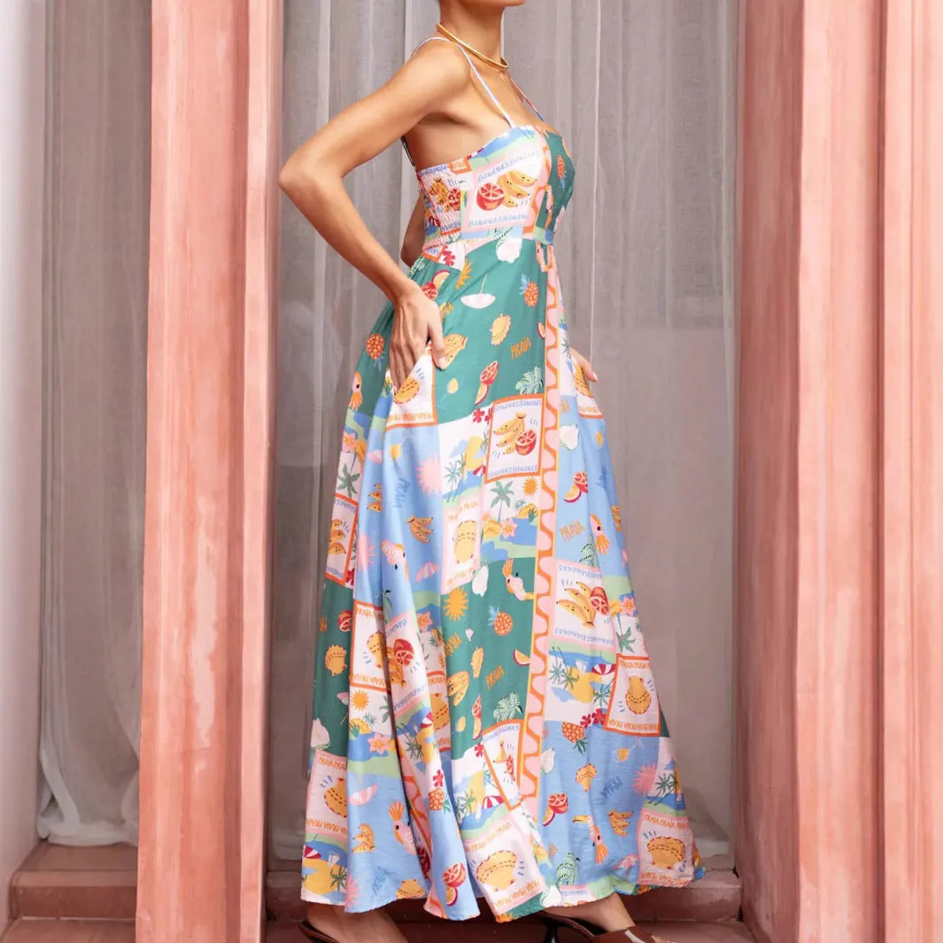 Women's green printed flared strap sleeveless long polyester dress with pockets on a model