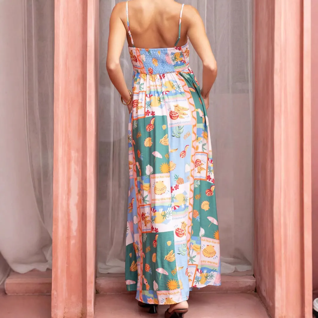 Women's green printed flared strap sleeveless long polyester dress with pockets on a model
