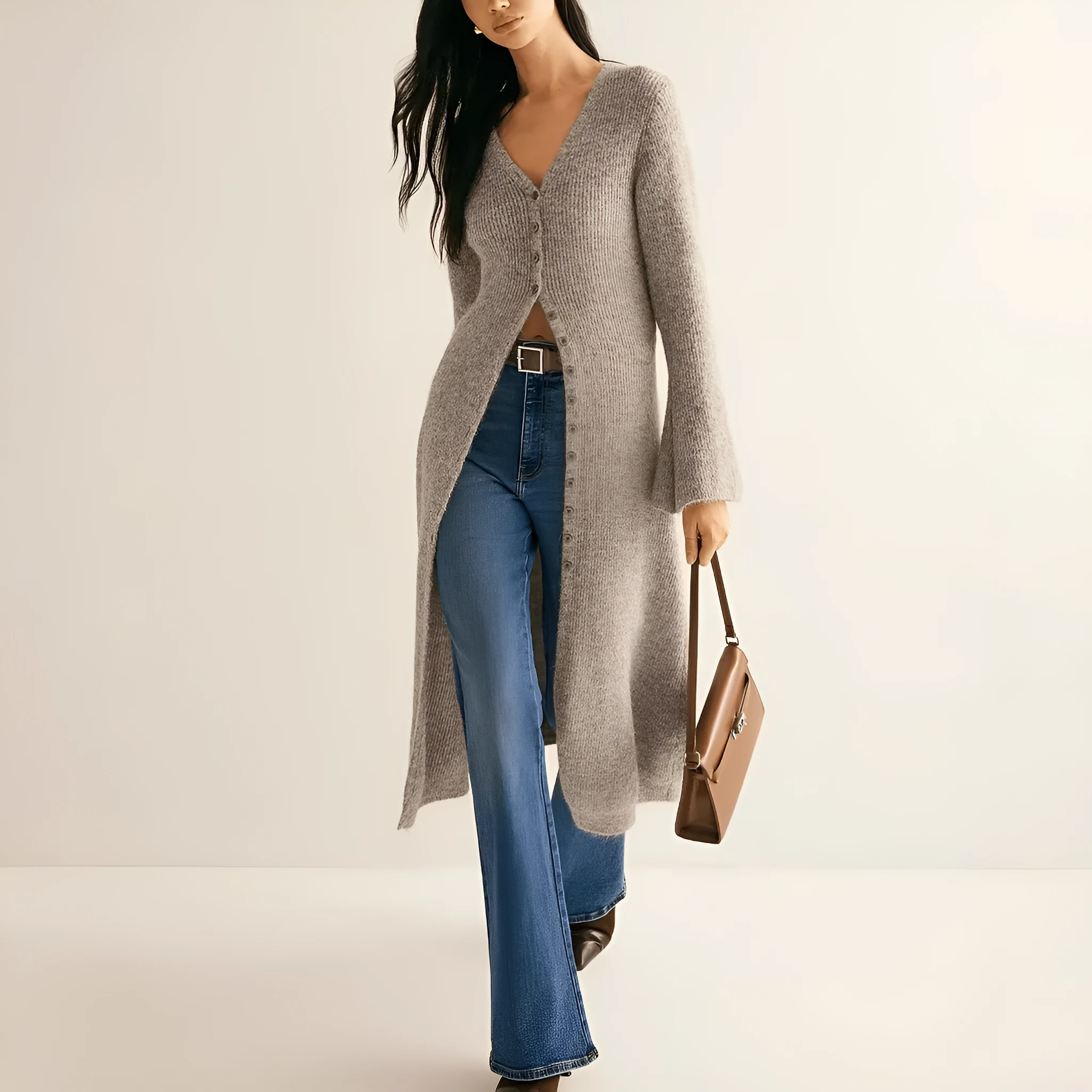 Khaki coloured women's long sleeve button-front cardigan coat on a hanger.