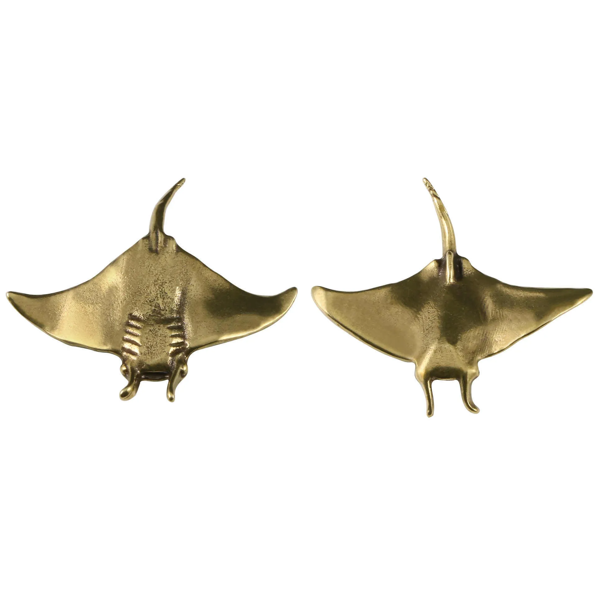 Brass devil fish ornament figurine on a surface, showing metallic colour and intricate devil fish design