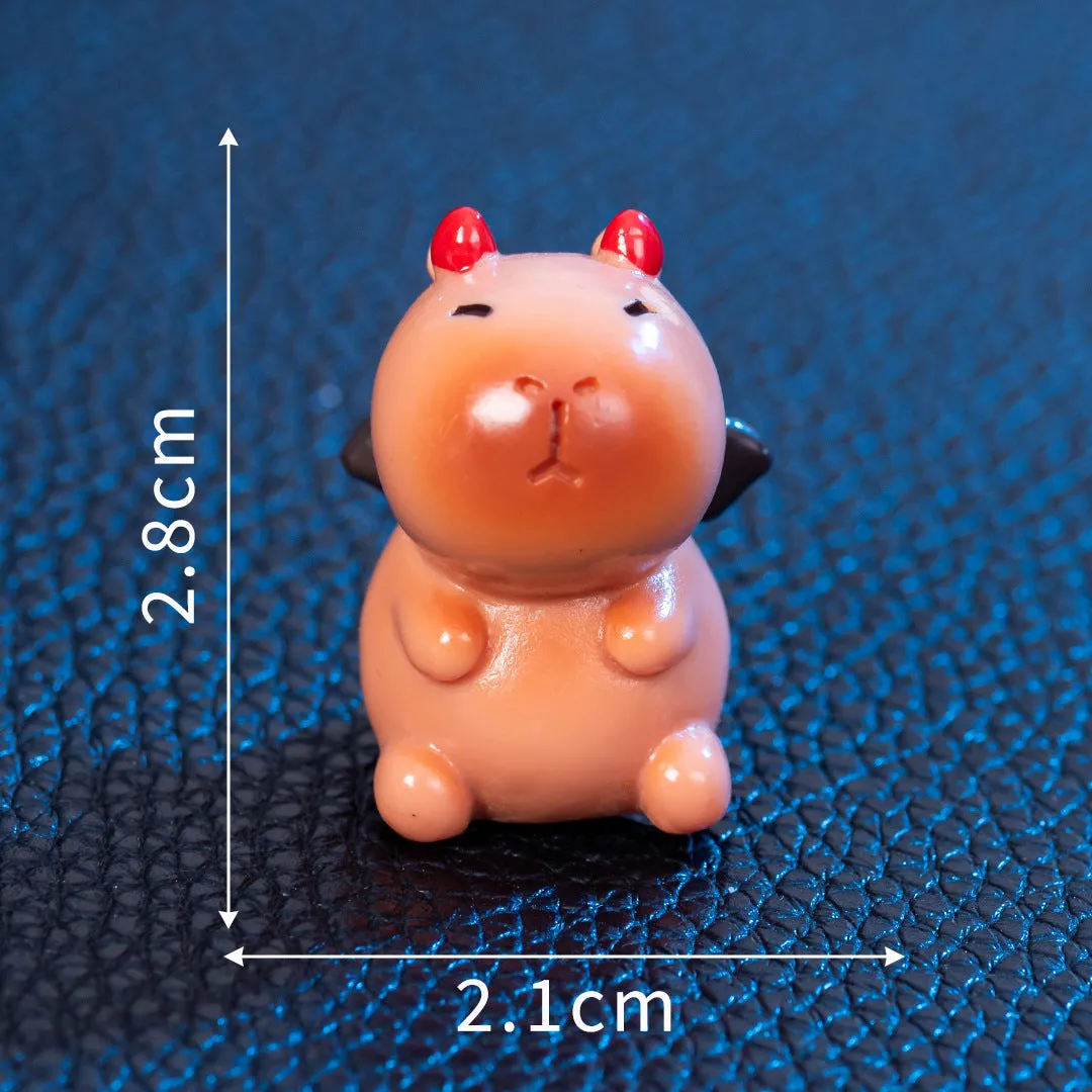 Eight different Halloween-themed capybara resin figurines displayed together