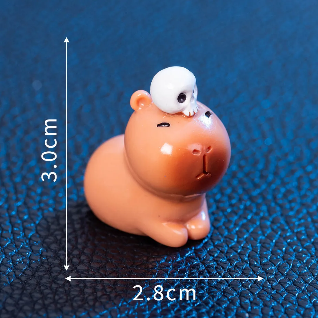 Eight different Halloween-themed capybara resin figurines displayed together