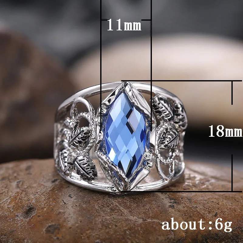 Women's blue crystal horse eye-shaped geometric alloy ring on a white background.