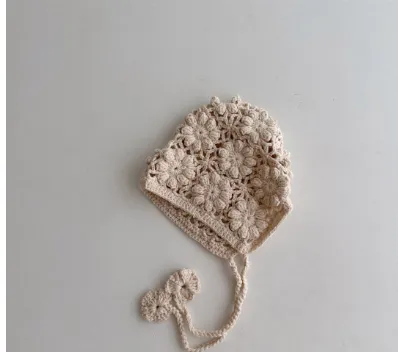 Breathable lace-up earflap winter hat for girls in beige with dome crown and jacquard weave