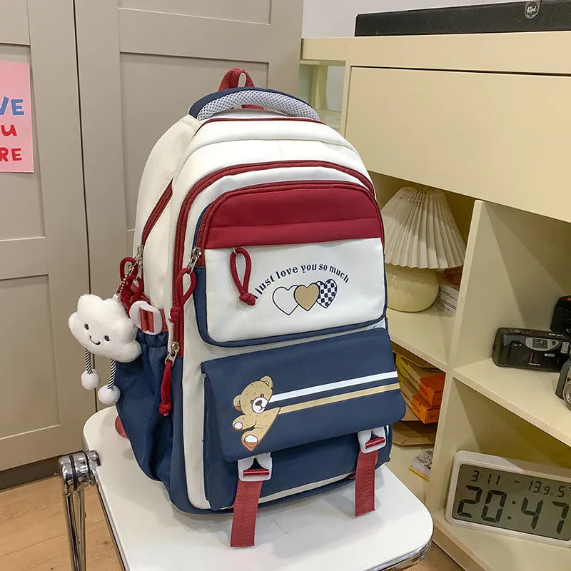 Nylon burden alleviation backpack for girls in pink long leg cloud design with outer sandwich pocket and stitching details