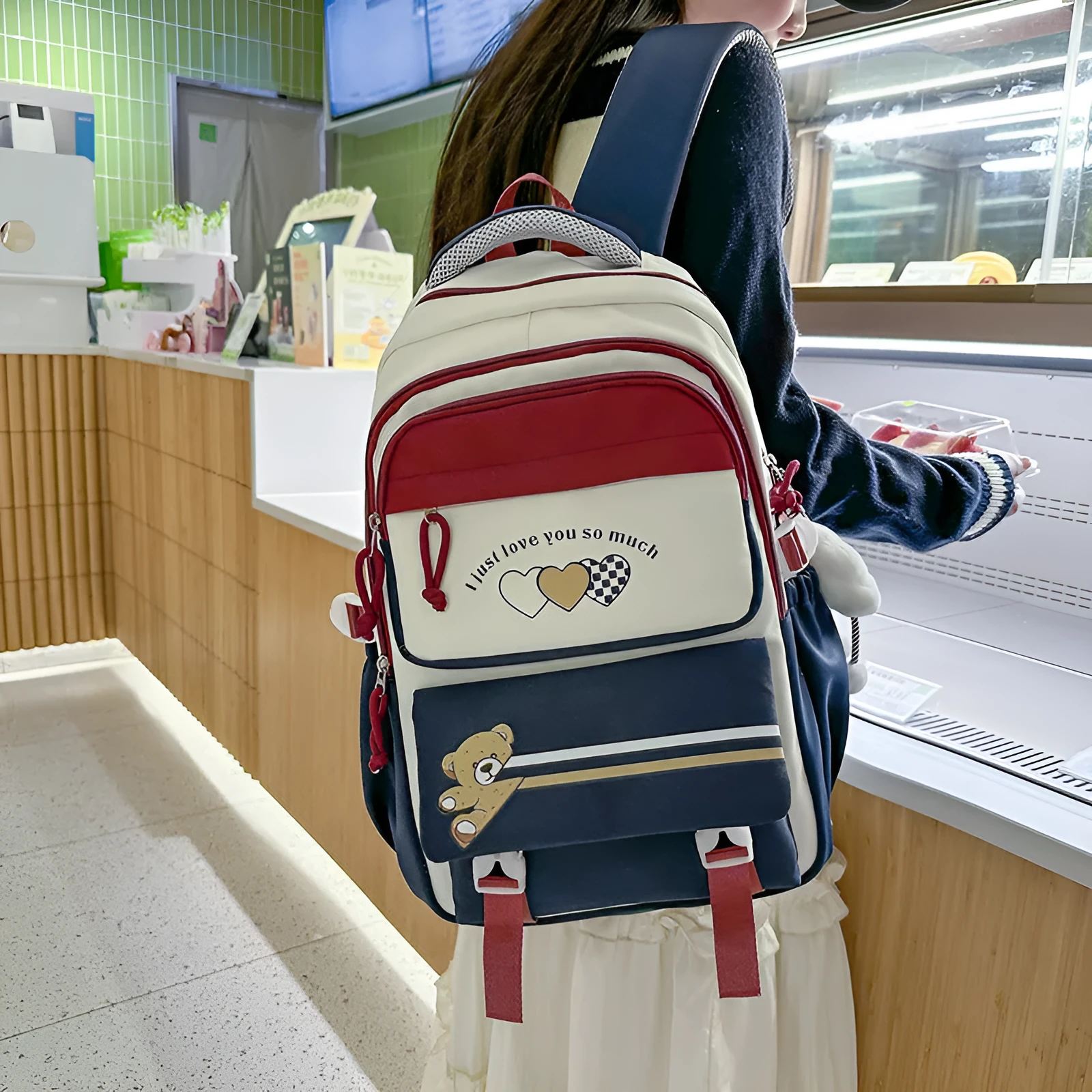 Nylon burden alleviation backpack for girls in pink long leg cloud design with outer sandwich pocket and stitching details