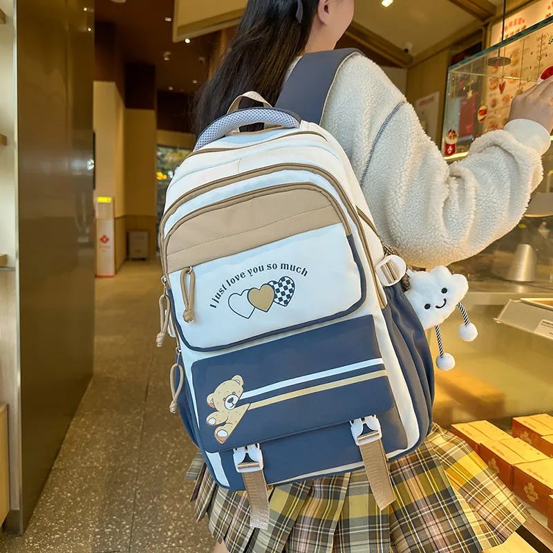 Nylon burden alleviation backpack for girls in pink long leg cloud design with outer sandwich pocket and stitching details
