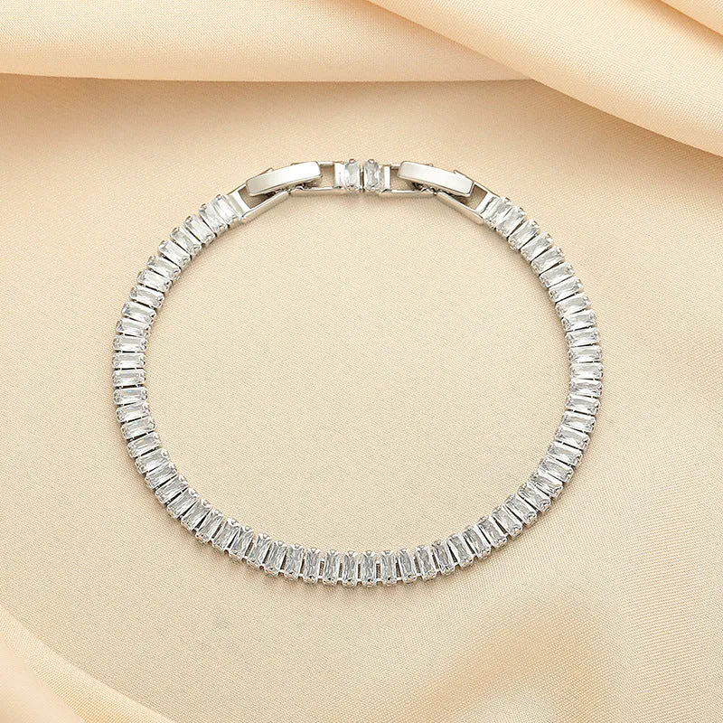 Rectangular brass women's bracelet with diamond zircon treatment in champagne gold colour