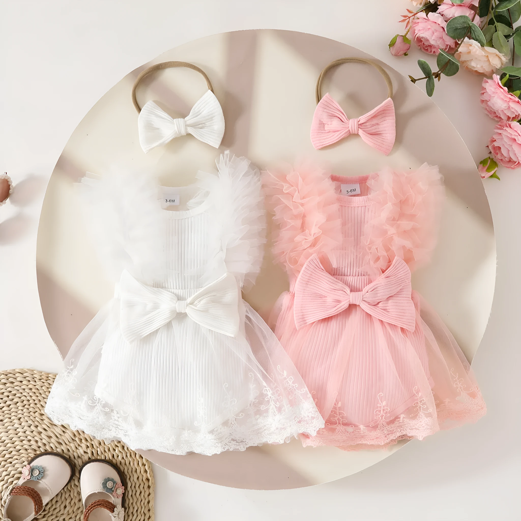 Baby girl in white triangle jumpsuit leotard with sweet bow hair band
