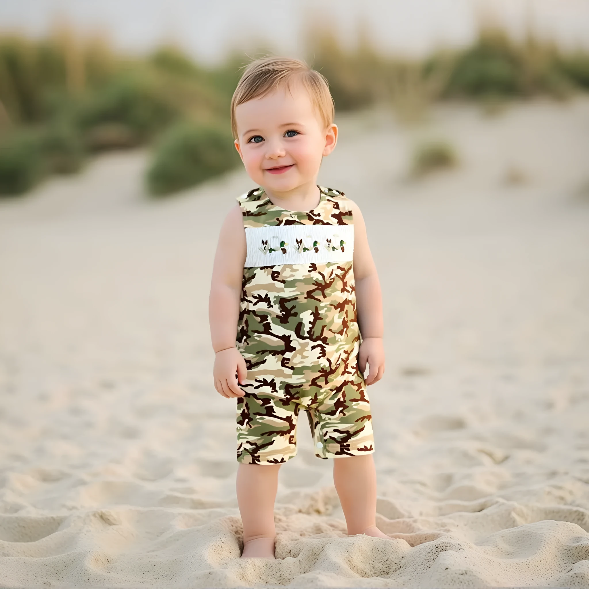 Infant toddler sleeveless duck embroidered romper in cotton knitted fabric, long sleeves, two colour options, front view.