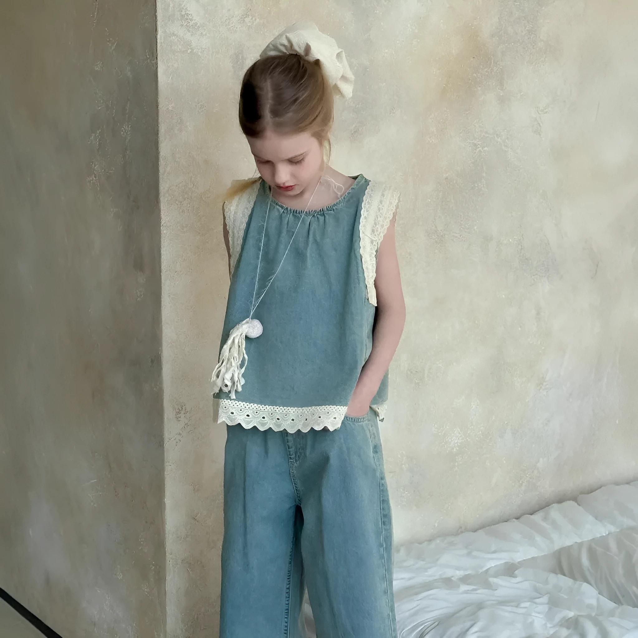 Light blue girls' lace trim denim cropped wide-leg pants and sleeveless vest two-piece set on child model
