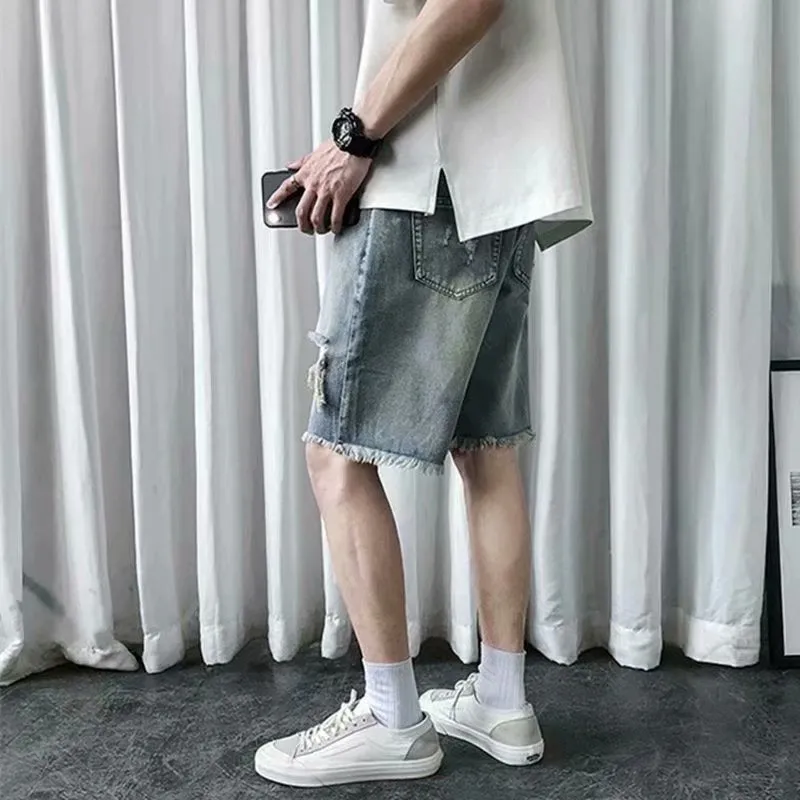 Men's thin ripped denim shorts in retro colour with handmade distressing, Bermuda length, size L