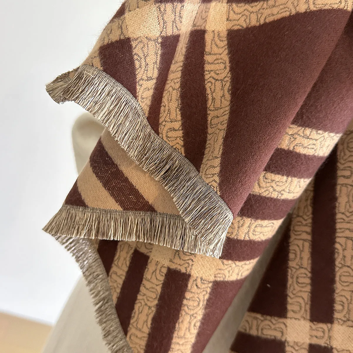 Long brown cashmere-like winter scarf with tassels laid flat showing its full 185cm length.