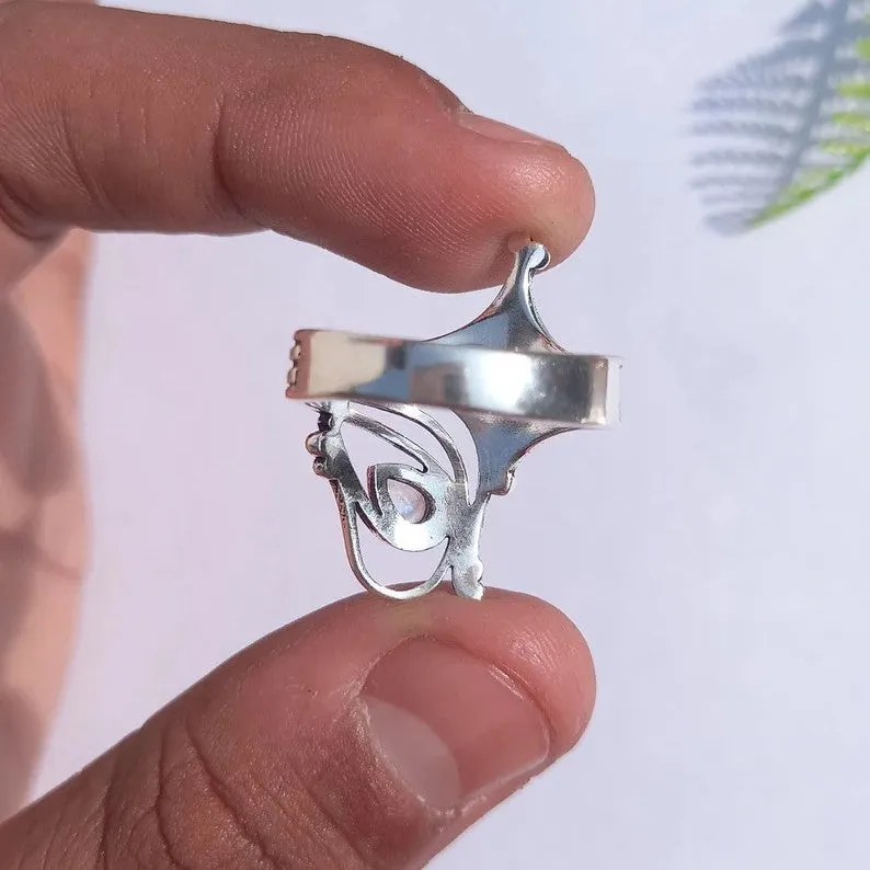 Retro wide hollow ring for women in silver zinc alloy electroplated finish on white background