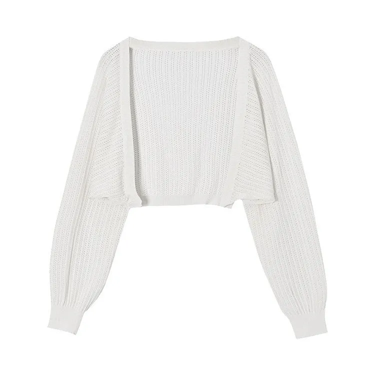 Thin polyester linen blouse with hollow out pattern and long lantern sleeves in apricot colour.