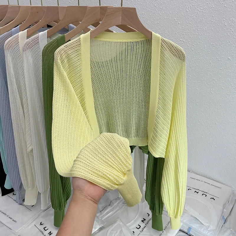 Thin polyester linen blouse with hollow out pattern and long lantern sleeves in apricot colour.
