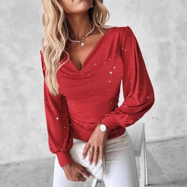 Women's red polyester draped neck top with flared long sleeves and sequin detail on a hanger