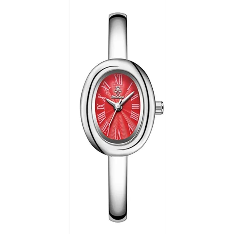 Women's gold and silver oval retro quartz watch with spiral patterns on a 8mm thick case.