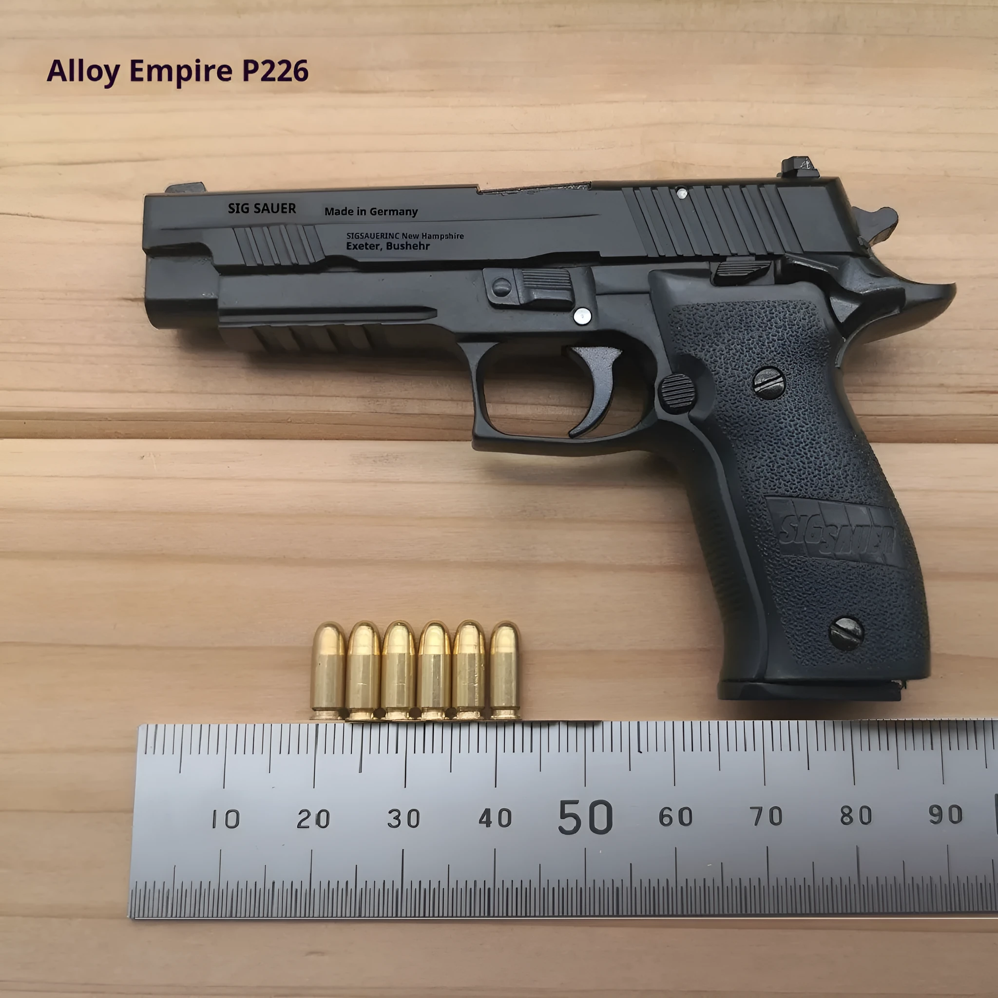 Alloy Empire Sigsauer P226 model toy gun in black metal finish on display stand