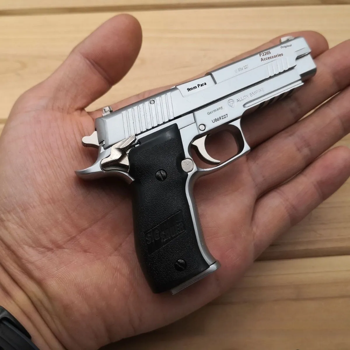 Alloy Empire Sigsauer P226 model toy gun in black metal finish on display stand