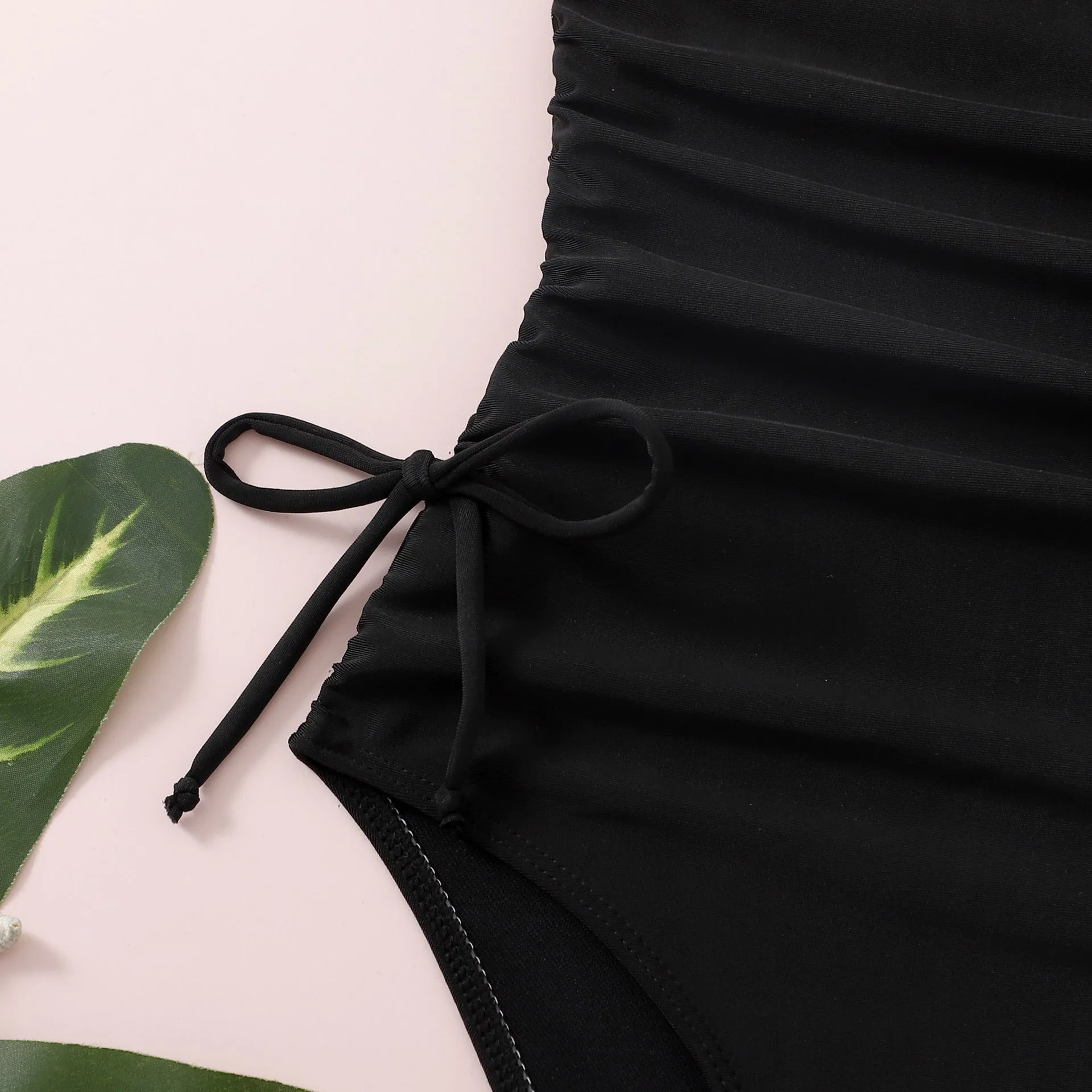 Children's solid black pleated tie swimsuit briefs in polyester spandex for swimming and wading