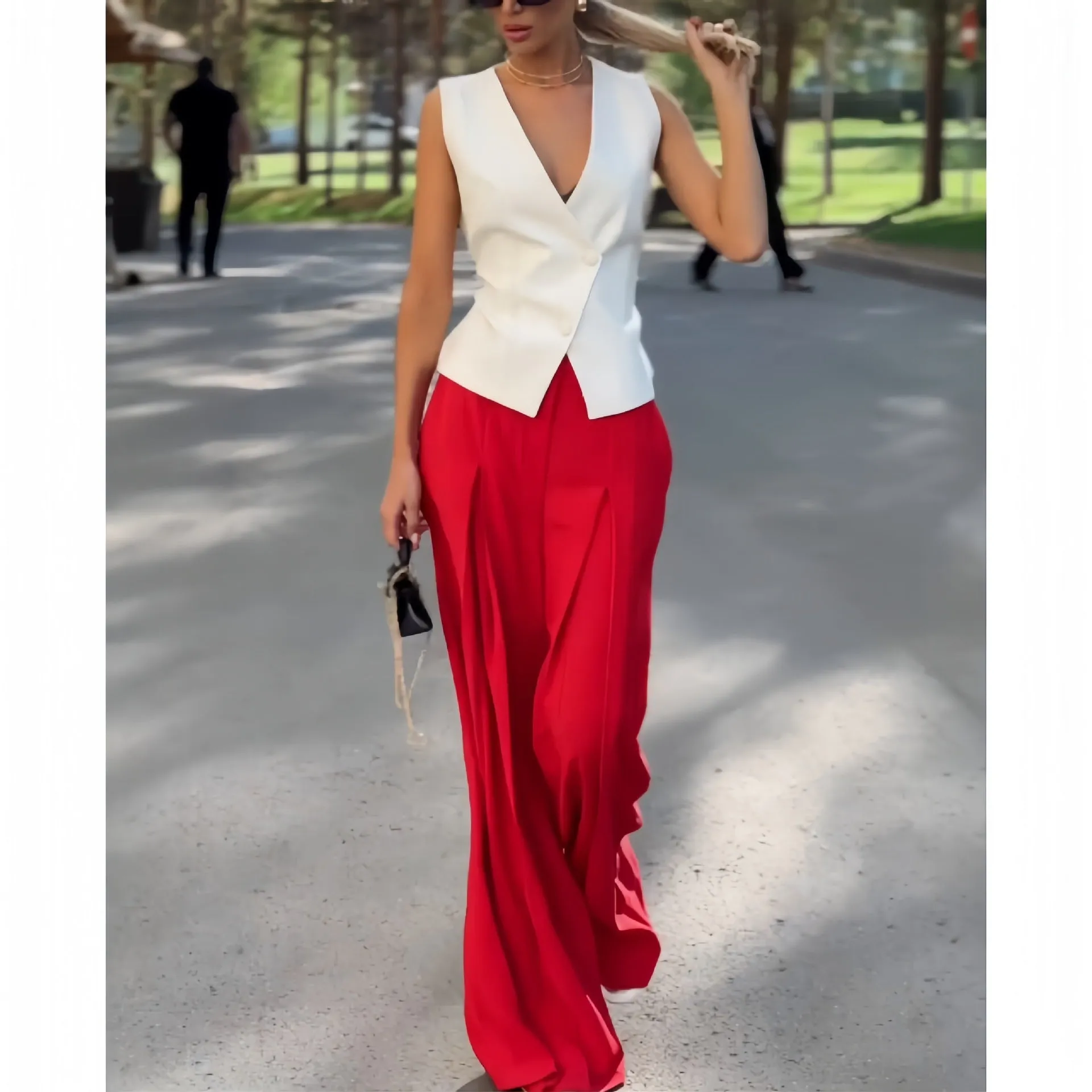 Women's beige two-piece set with deep V-neck sleeveless top and wide-leg trousers