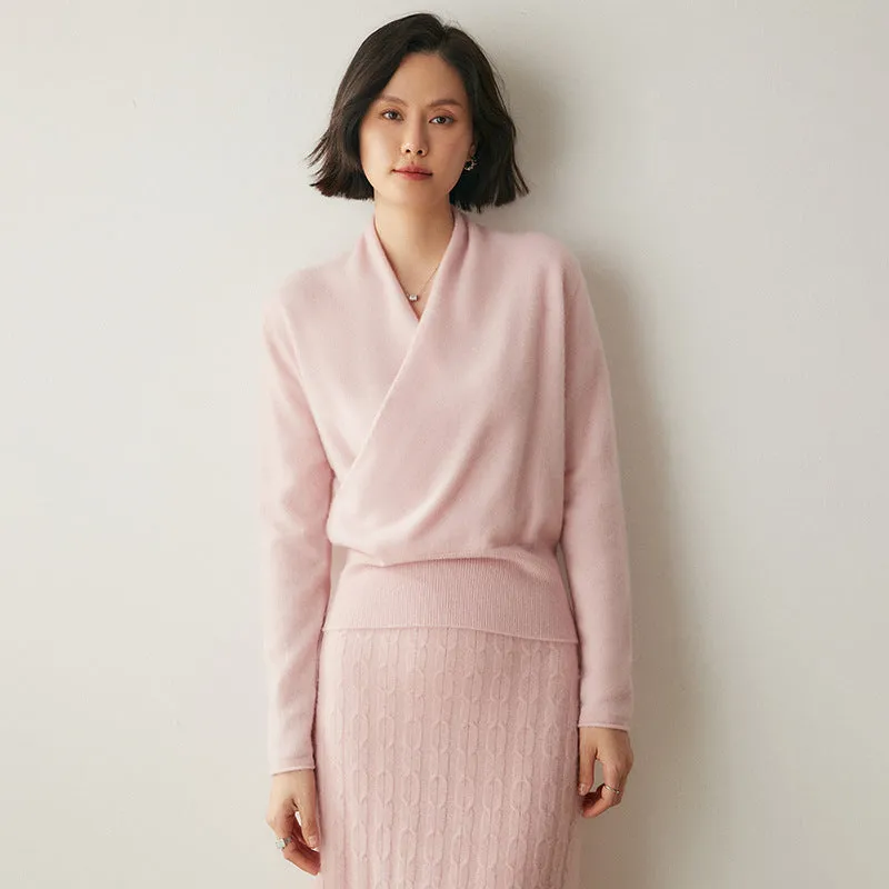 Women's solid colour cashmere V-neck cross sweater top with long sleeves in Elegant Camel, shown on a model.