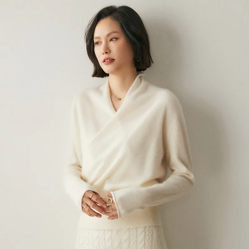Women's solid colour cashmere V-neck cross sweater top with long sleeves in Elegant Camel, shown on a model.