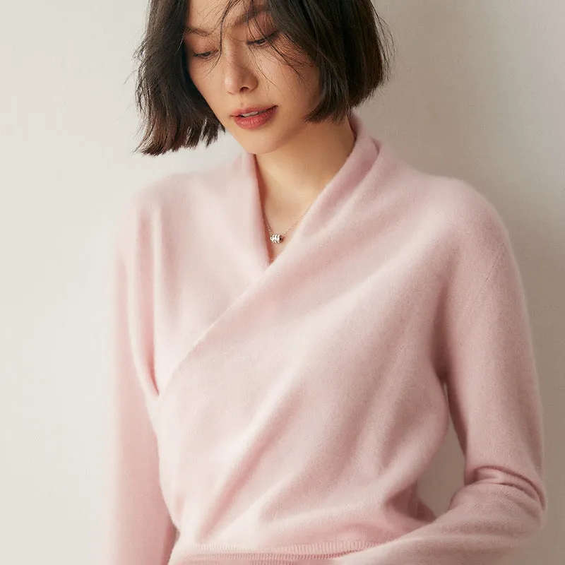 Women's solid colour cashmere V-neck cross sweater top with long sleeves in Elegant Camel, shown on a model.