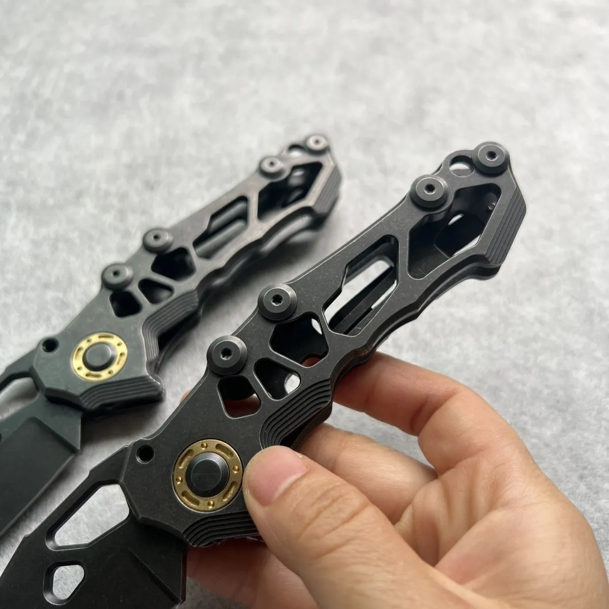 D2 steel folding knife with 9cm blade on outdoor background