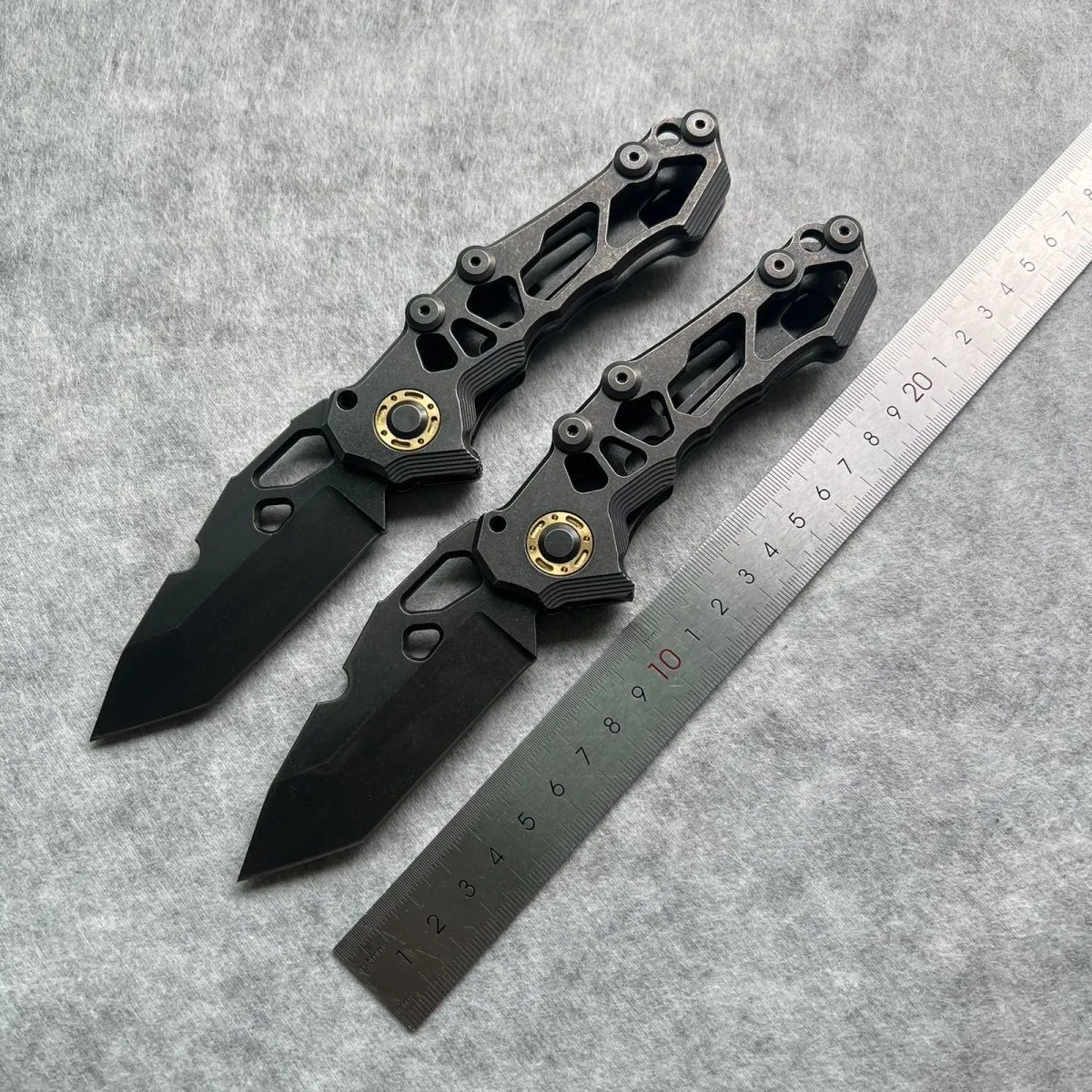 D2 steel folding knife with 9cm blade on outdoor background