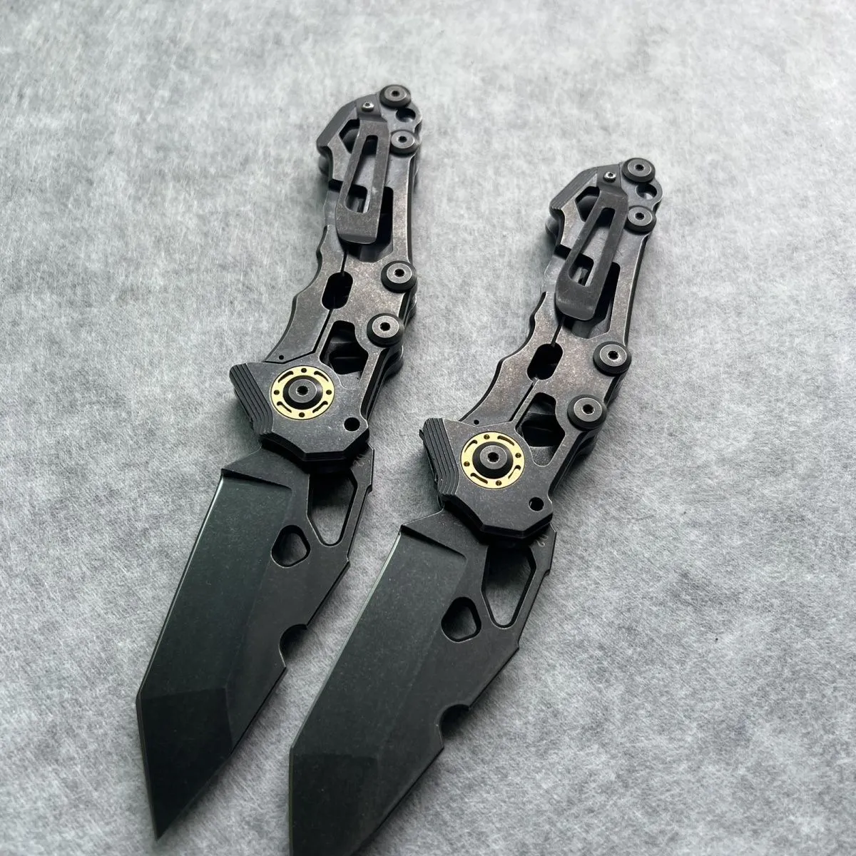 D2 steel folding knife with 9cm blade on outdoor background