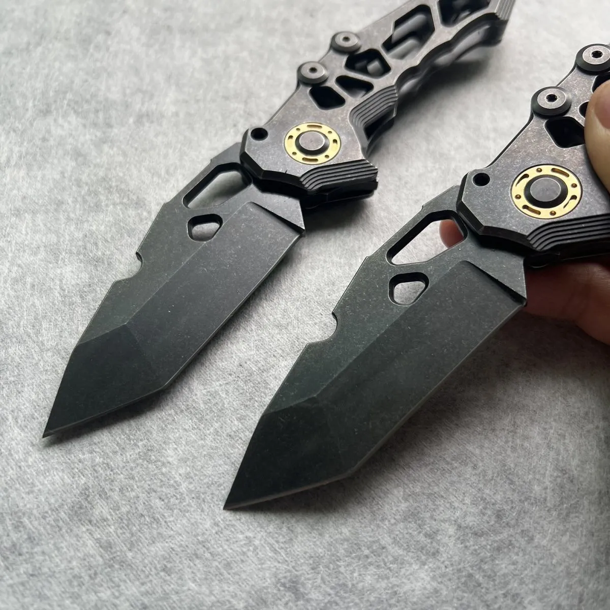 D2 steel folding knife with 9cm blade on outdoor background