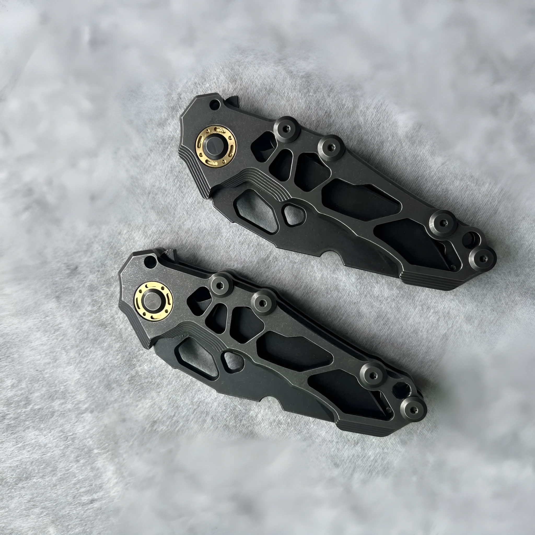 D2 steel folding knife with 9cm blade on outdoor background