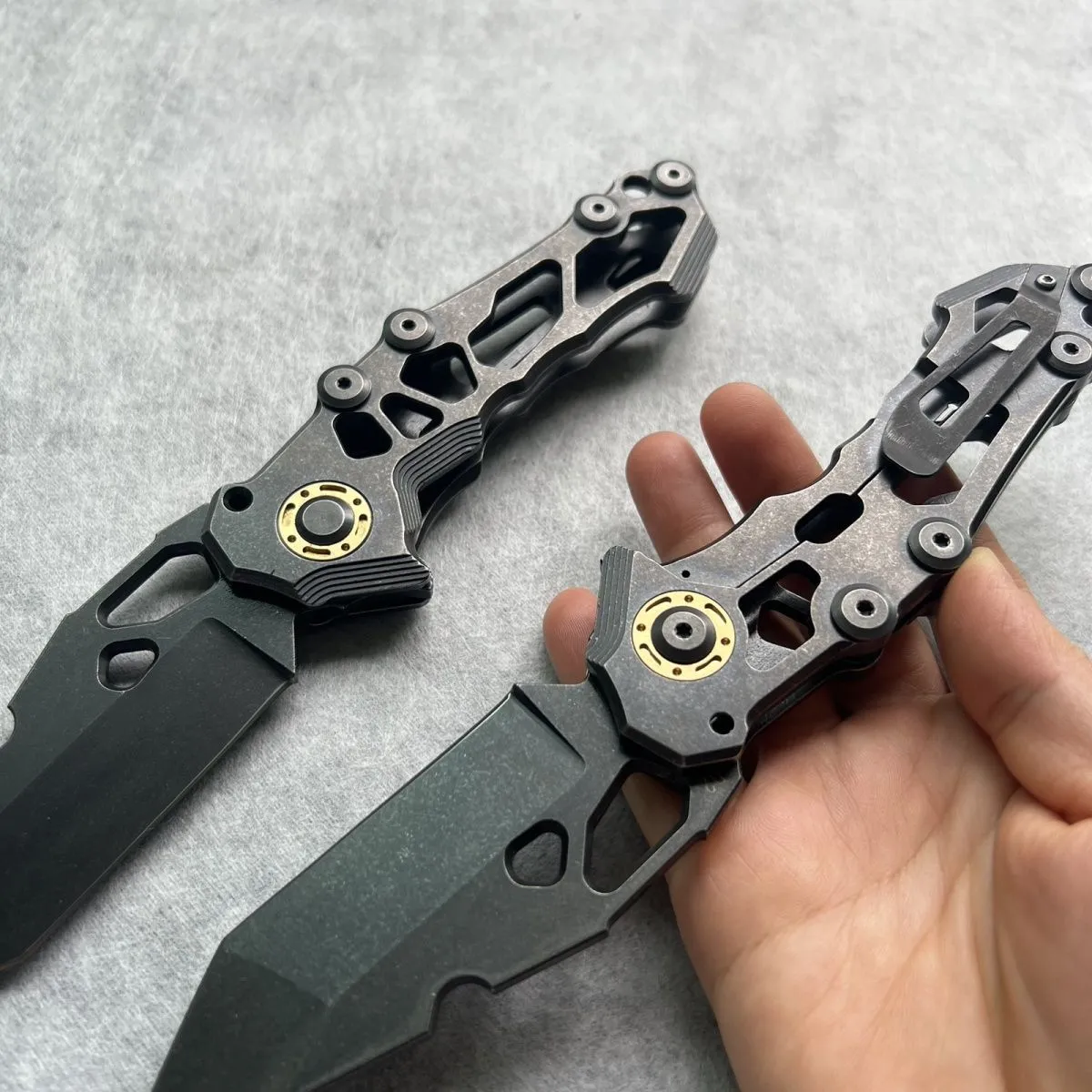 D2 steel folding knife with 9cm blade on outdoor background