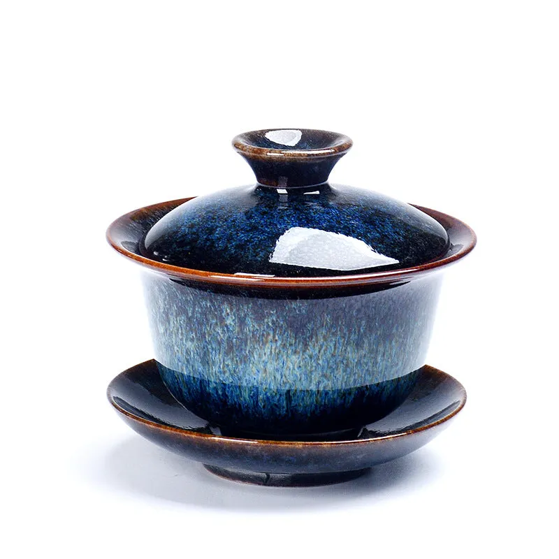 Handcrafted ceramic three-piece tea set with covered bowl and teacup in transmutation glaze finish