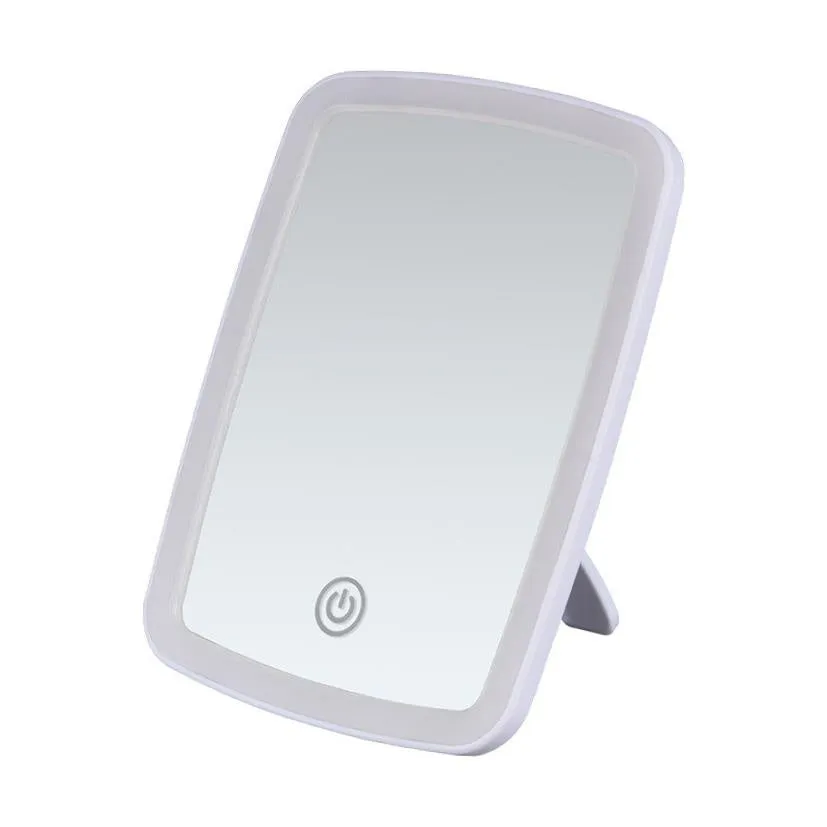 Simple desktop home LED makeup mirror with USB charging and ABS frame on a tabletop