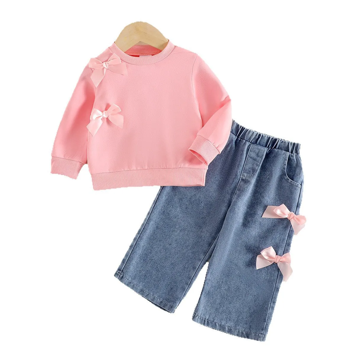 Pink two-piece baby girls outfit with long-sleeved sweater and trousers in cotton