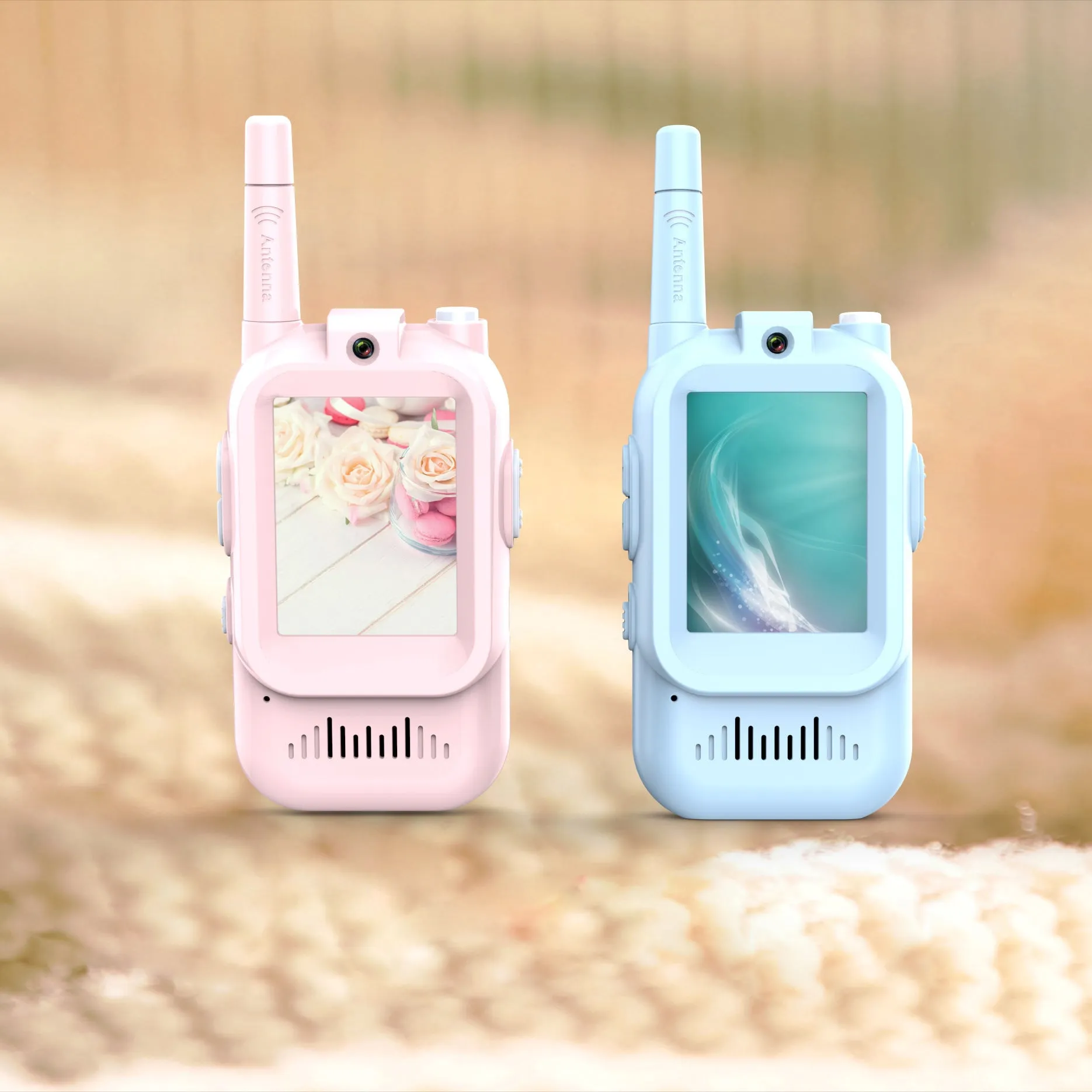 Two mini video walkie talkies for kids in pink and blue with 2.0 inch screen and charging cable