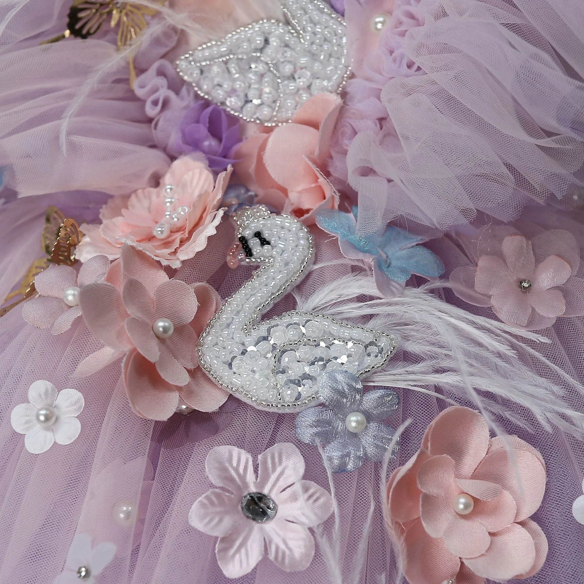 Light purple children's flower-patterned tulle tutu princess dress with feather trim on a white background