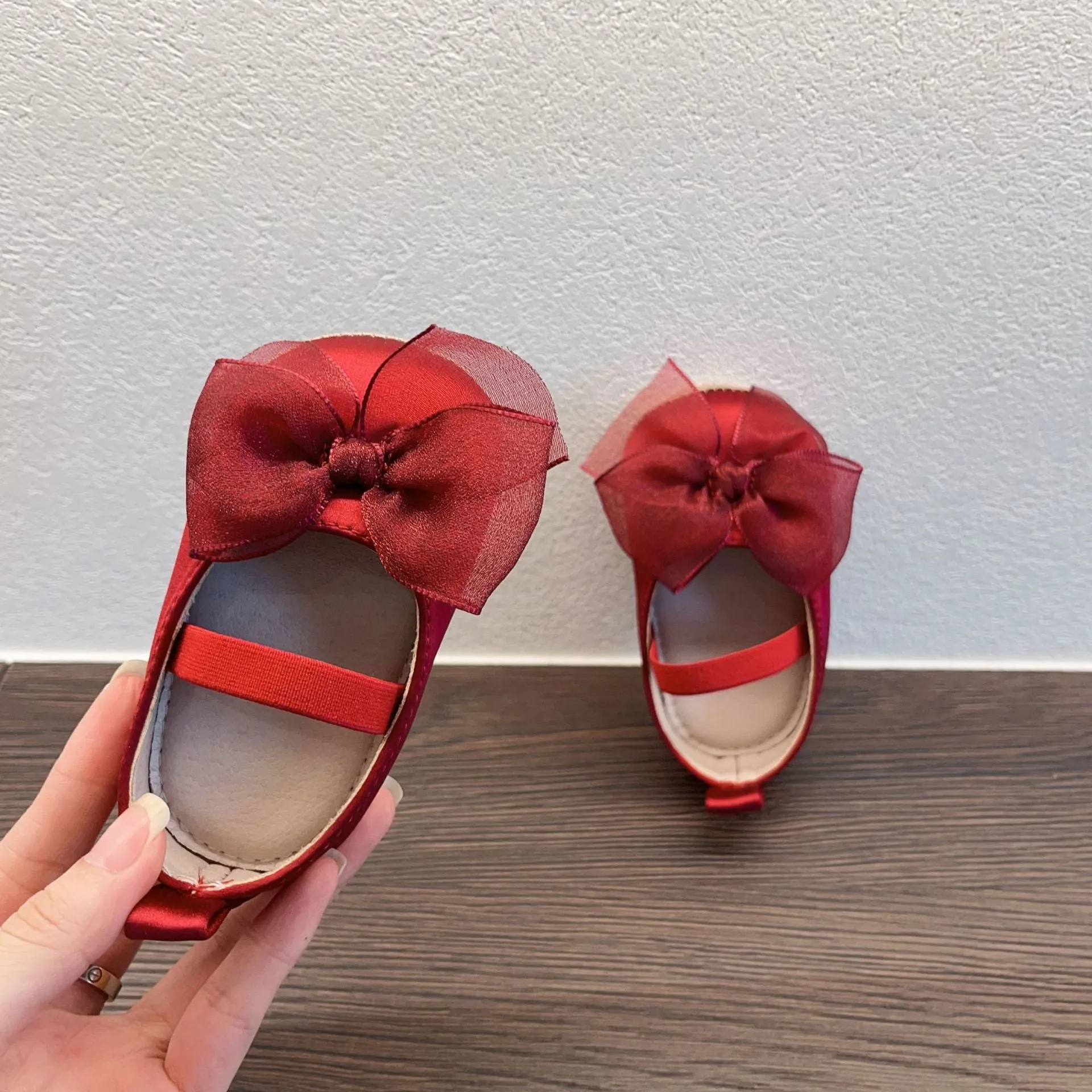 Princess toddler soft bottom pumps in festive red with bow pattern real silk upper elastic band closure