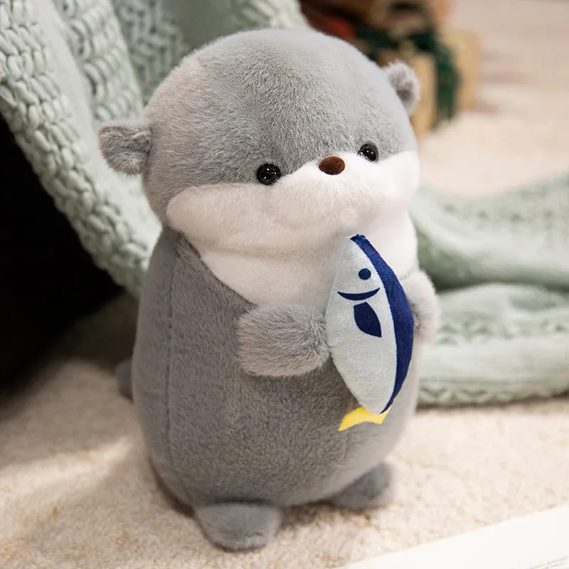 Small otter plush doll holding a fish in short plush fabric, available in brown and gray, 30cm or 40cm height