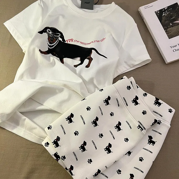 Girls short sleeve pyjama set with sausage dog print and sunglasses design in polyester