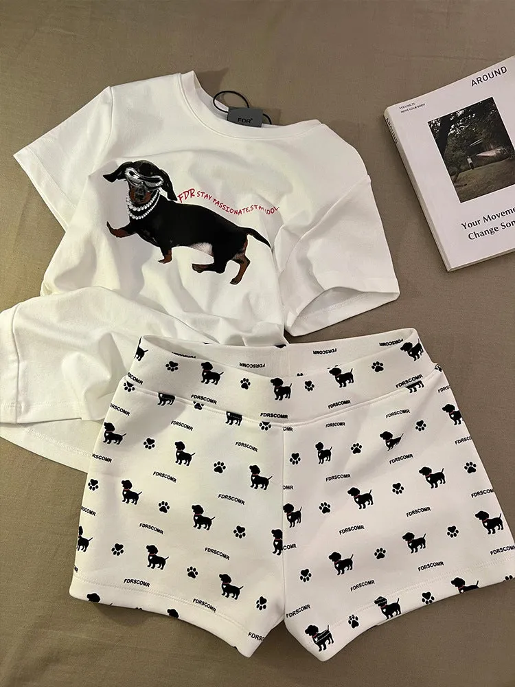 Girls short sleeve pyjama set with sausage dog print and sunglasses design in polyester