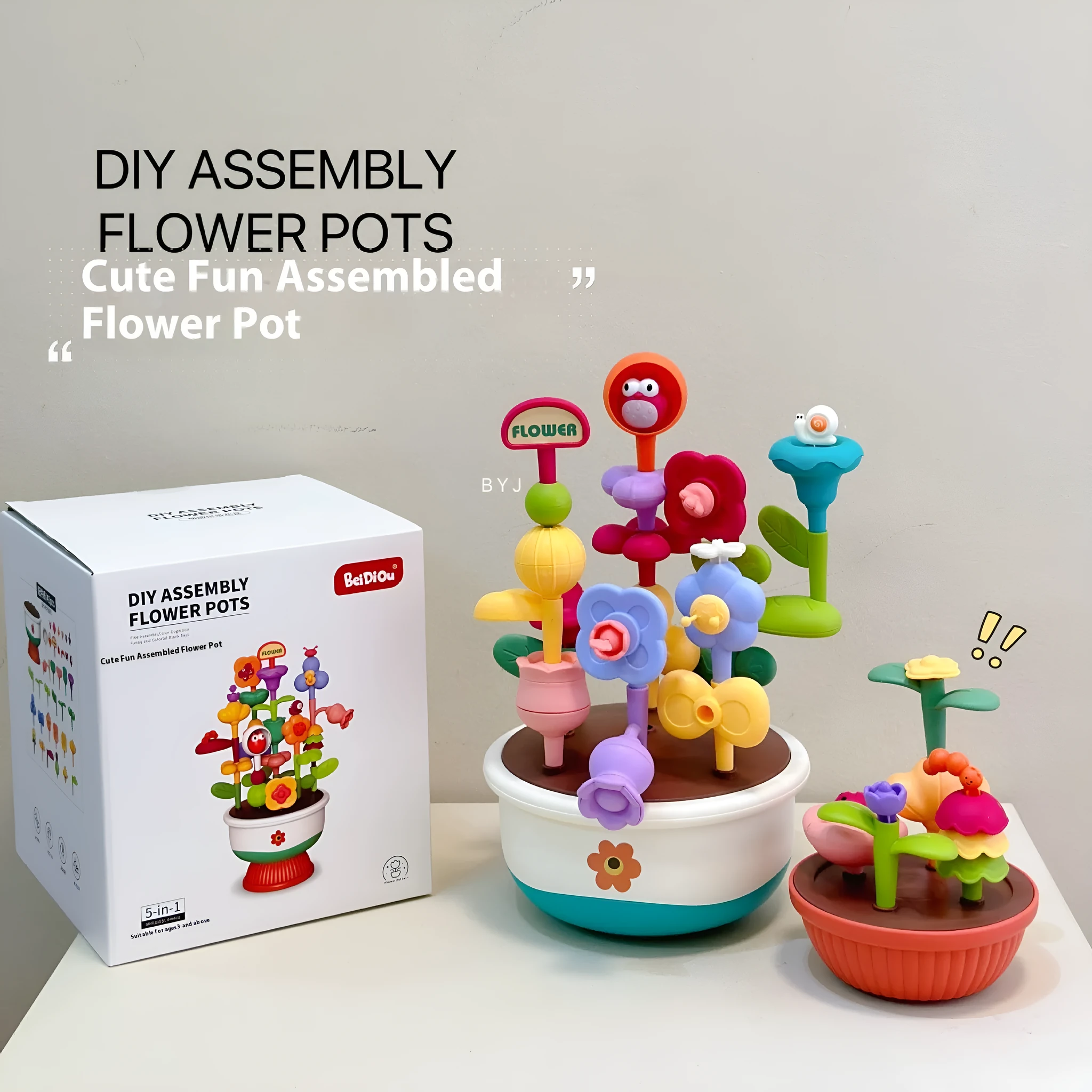 Colourful plastic flowerpot building block set with assorted flower-shaped pieces, in a colour box