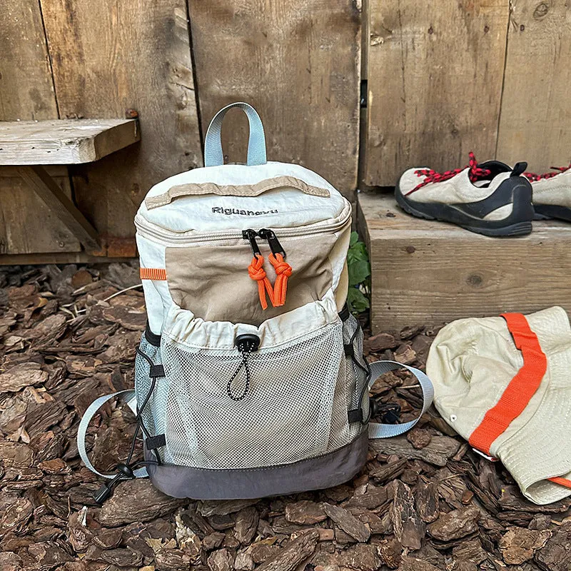 Waterproof nylon casual backpack in solid colour with curved shoulder straps and fold design details